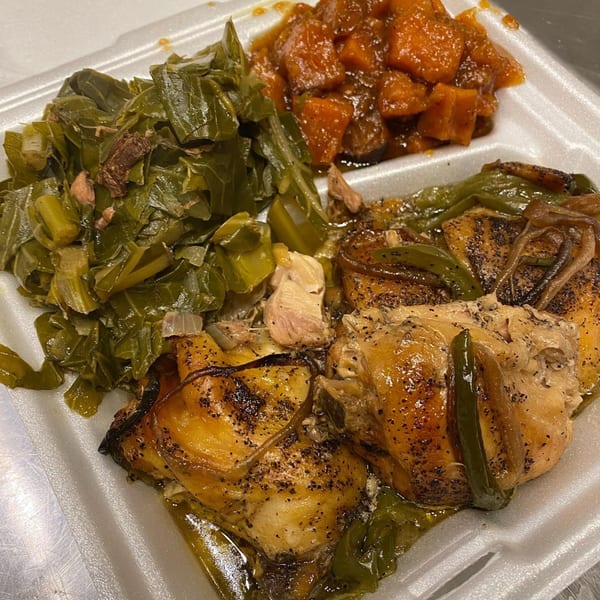 Marie's Soul Food chicken, collard greens, and candied yams in a takeout container.